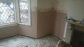 A damp patch that indicates rising damp.